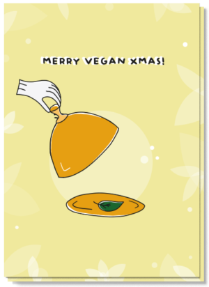 Voorkant kerstkaart met daarop een spinazieblaadjes op een bord met de tekst "Merry Vegan Xmas"